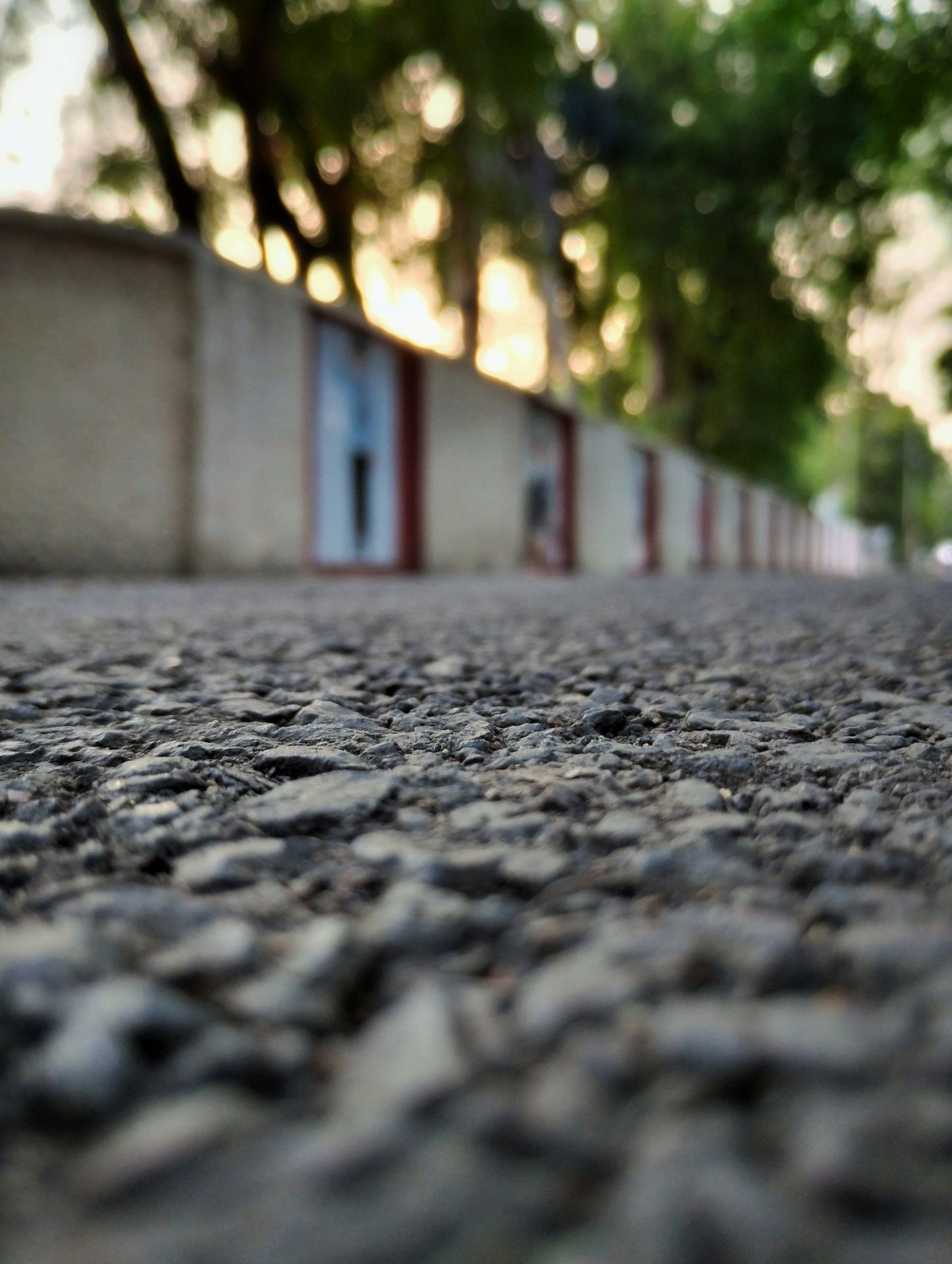 a close up of a street with a building in the background